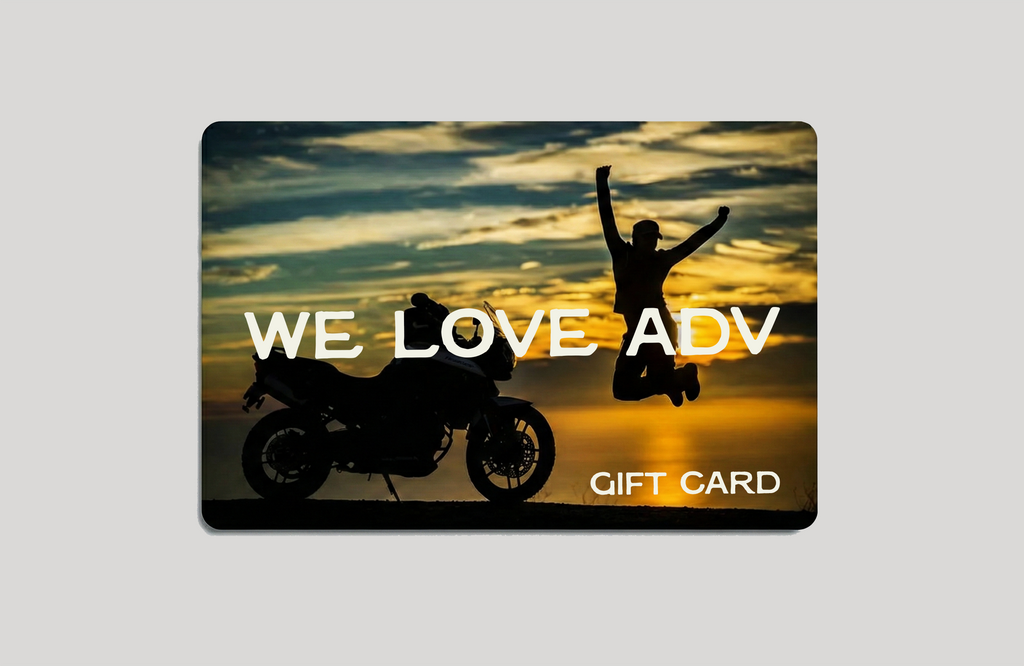 Gift card with a silhouette of a person jumping and a motorcycle against a sunset sky, with 'WE LOVE ADV' text.